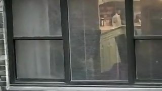 Topless neighbor girl in a window peep